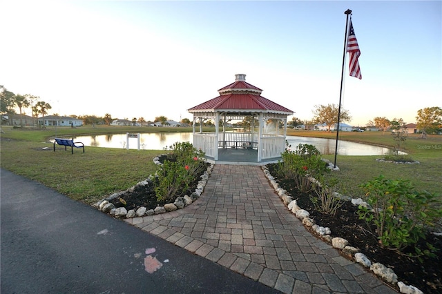 view of property's community featuring a gazebo, a yard, and a water view