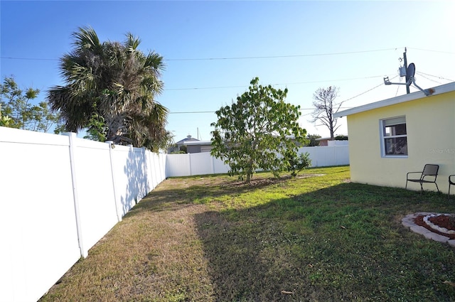 view of yard with a fenced backyard