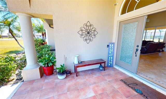 569 Royal Poinciana, Punta Gorda, FL 33955 - doorway to property featuring stucco siding