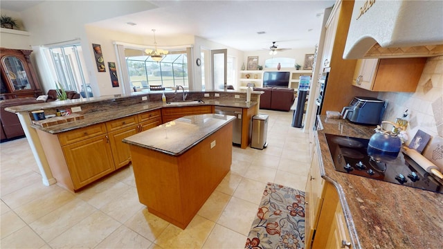 569 Royal Poinciana, Punta Gorda, FL 33955 - kitchen with a sink, black electric stovetop, open floor plan, a large island with sink, and stainless steel dishwasher