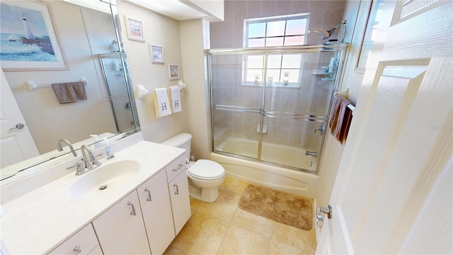 569 Royal Poinciana, Punta Gorda, FL 33955 - full bath with tile patterned flooring, toilet, vanity, and bath / shower combo with glass door