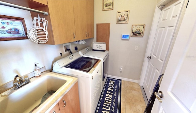 569 Royal Poinciana, Punta Gorda, FL 33955 - laundry room with a sink, cabinet space, light tile patterned floors, baseboards, and washing machine and clothes dryer