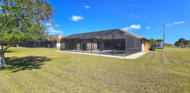 569 Royal Poinciana, Punta Gorda, FL 33955 - view of yard featuring glass enclosure and an outdoor pool