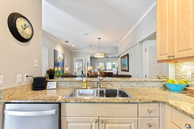 kitchen with light brown cabinetry, a sink, light stone counters, open floor plan, and dishwasher