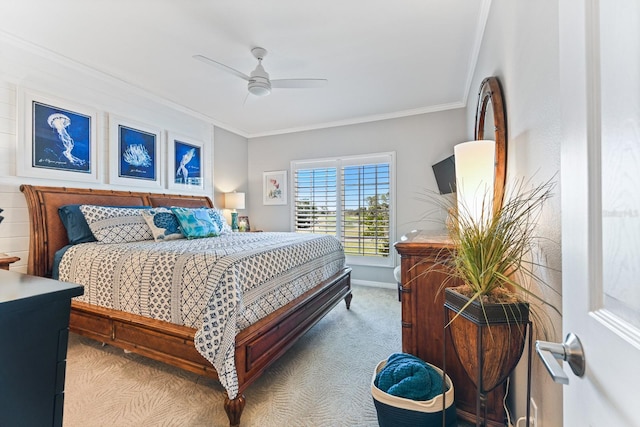 bedroom with carpet flooring, baseboards, a ceiling fan, and ornamental molding