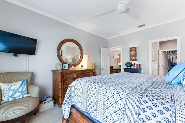 carpeted bedroom featuring a ceiling fan, visible vents, and ornamental molding