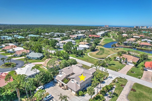 birds eye view of property featuring a residential view, view of golf course, and a water view