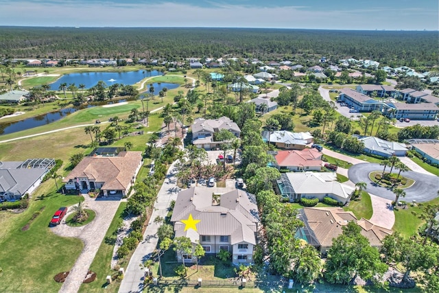 aerial view featuring view of golf course, a water view, and a residential view