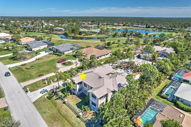 drone / aerial view with a residential view and a water view