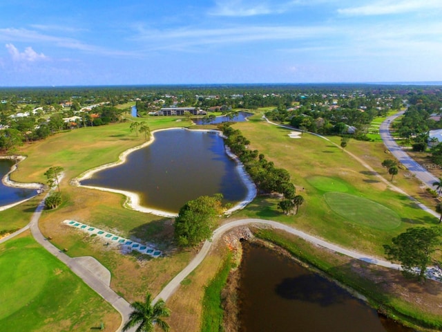 birds eye view of property featuring golf course view and a water view