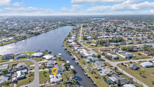 aerial view with a residential view and a water view