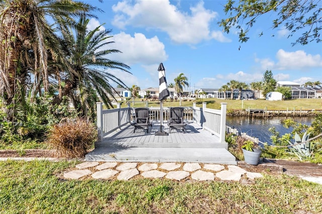 exterior space with a yard and a water view