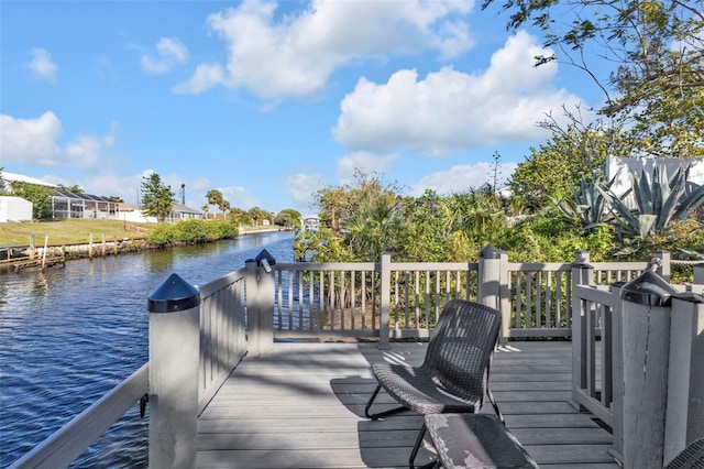 wooden deck featuring a water view