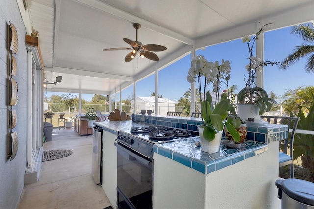 view of patio / terrace featuring ceiling fan