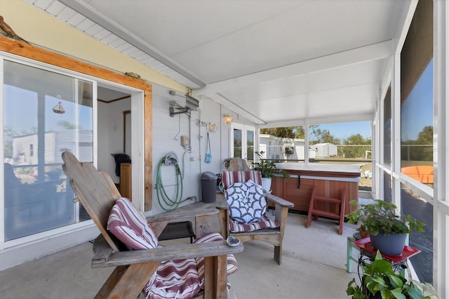 sunroom featuring beamed ceiling