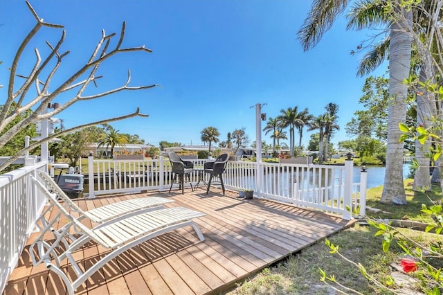 wooden terrace with a water view