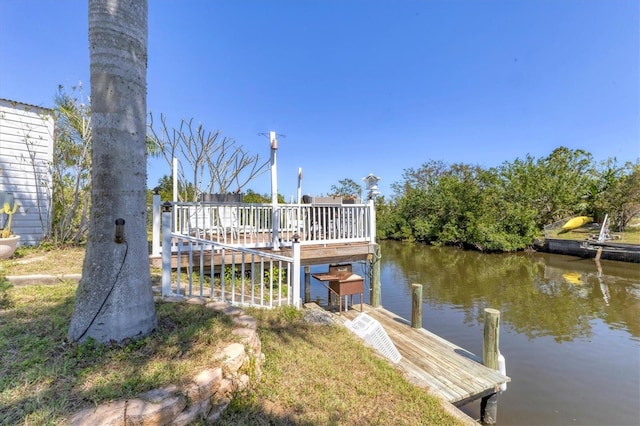 view of dock with a deck with water view