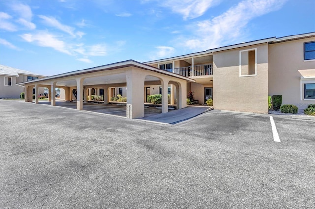 view of partially covered parking lot