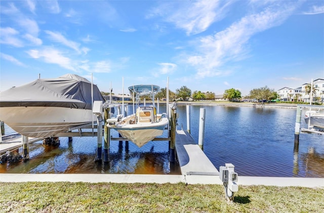 dock area with a water view and boat lift