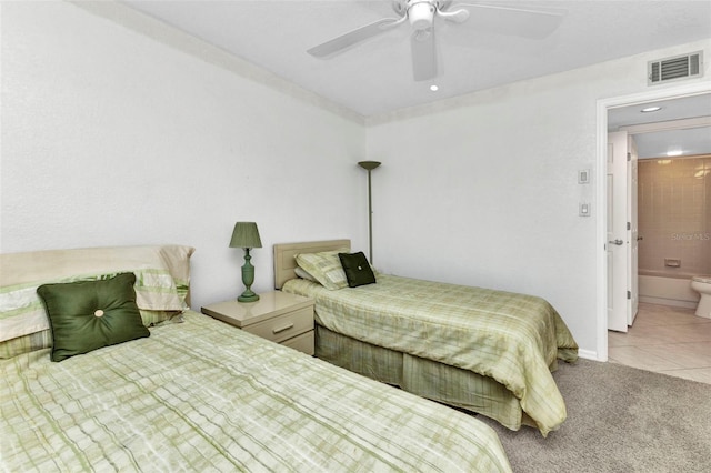 bedroom featuring carpet, baseboards, visible vents, ceiling fan, and tile patterned flooring