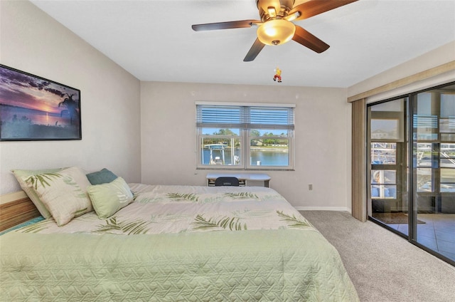 carpeted bedroom featuring a ceiling fan and baseboards