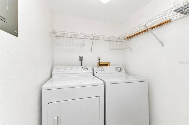 clothes washing area featuring laundry area and separate washer and dryer