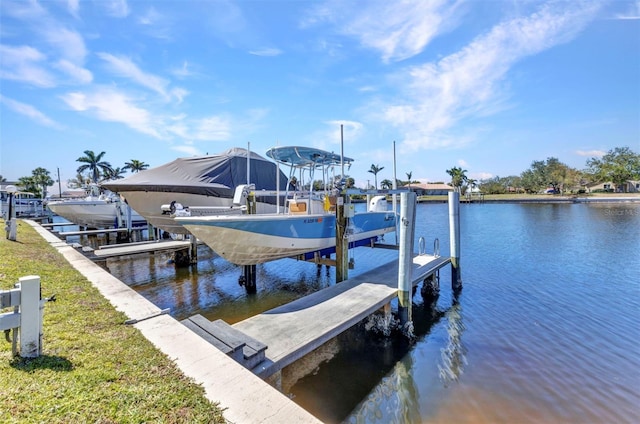 view of dock featuring a water view and boat lift