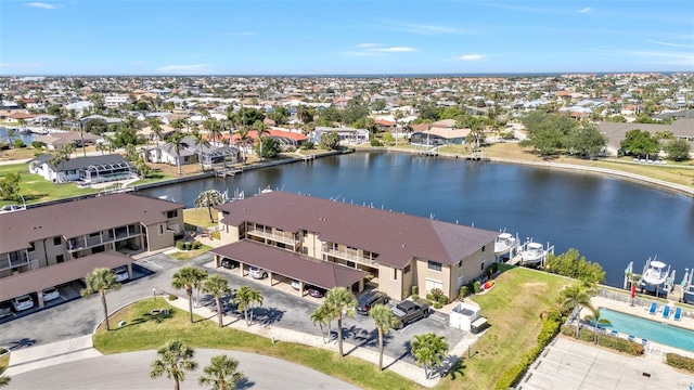 birds eye view of property featuring a residential view and a water view
