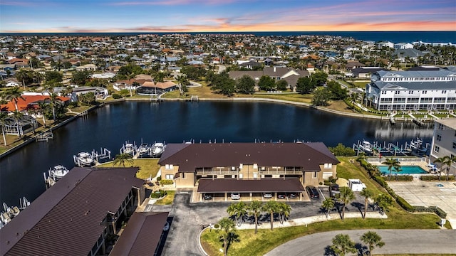 aerial view featuring a water view and a residential view