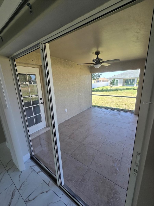 view of patio with ceiling fan