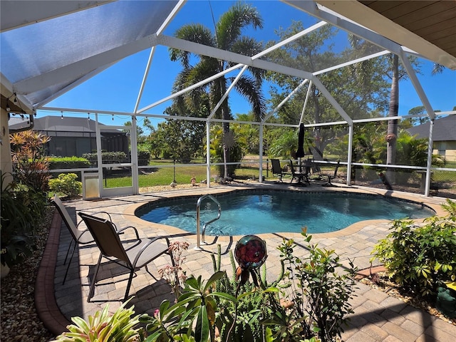 pool with a patio and a lanai