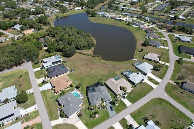 bird's eye view with a residential view and a water view