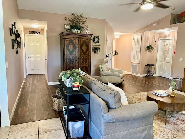 living area with visible vents, wood finished floors, ceiling fan, and vaulted ceiling