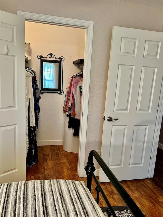 spacious closet featuring wood finished floors