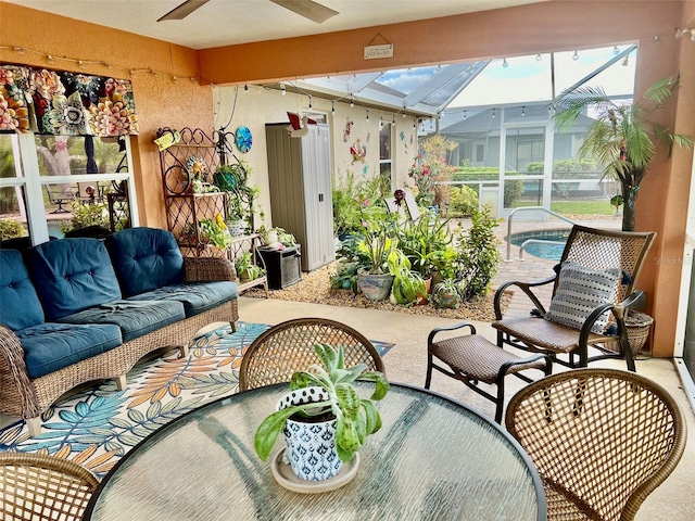 sunroom / solarium with ceiling fan