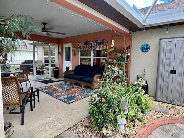 exterior space with an outdoor hangout area, outdoor dining area, and ceiling fan