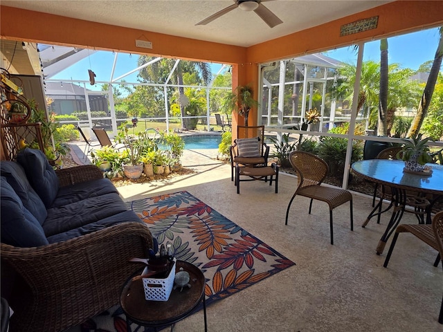 sunroom with a ceiling fan