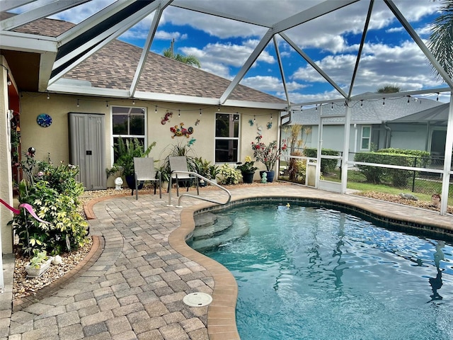 pool featuring a lanai and a patio