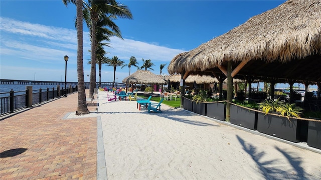 view of property's community with a gazebo and a water view