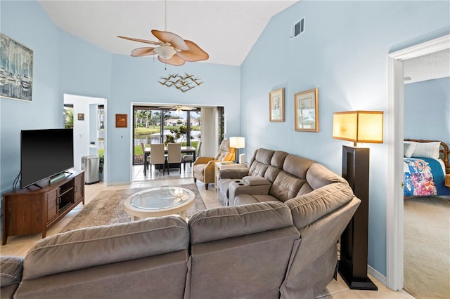 living area featuring visible vents, high vaulted ceiling, and ceiling fan