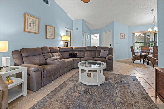 living area with baseboards, visible vents, light tile patterned flooring, vaulted ceiling, and a chandelier