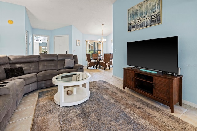 tiled living room with baseboards, a chandelier, and vaulted ceiling