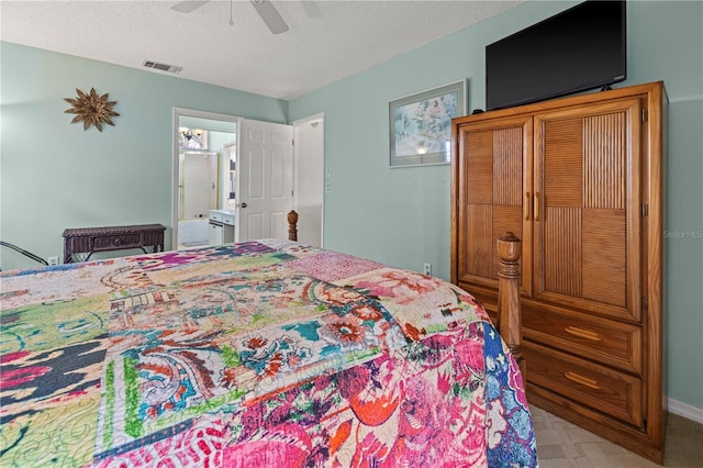 bedroom featuring ensuite bath, a ceiling fan, visible vents, and a textured ceiling