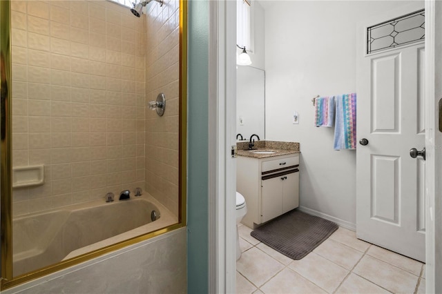 bathroom with tile patterned flooring, baseboards, toilet, shower / tub combination, and vanity