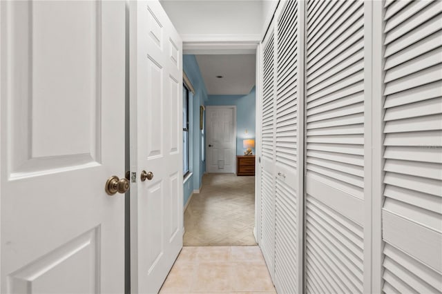 hallway featuring light tile patterned flooring