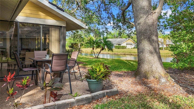 view of patio with a water view