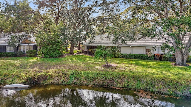 view of yard with a water view