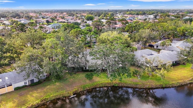 drone / aerial view featuring a residential view and a water view