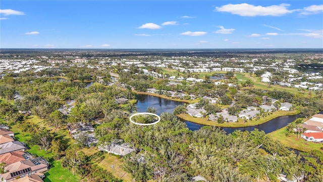 birds eye view of property with a residential view and a water view