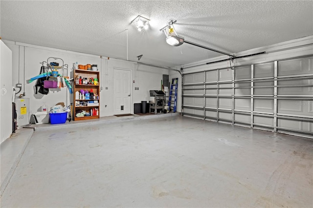 garage featuring a garage door opener and electric water heater